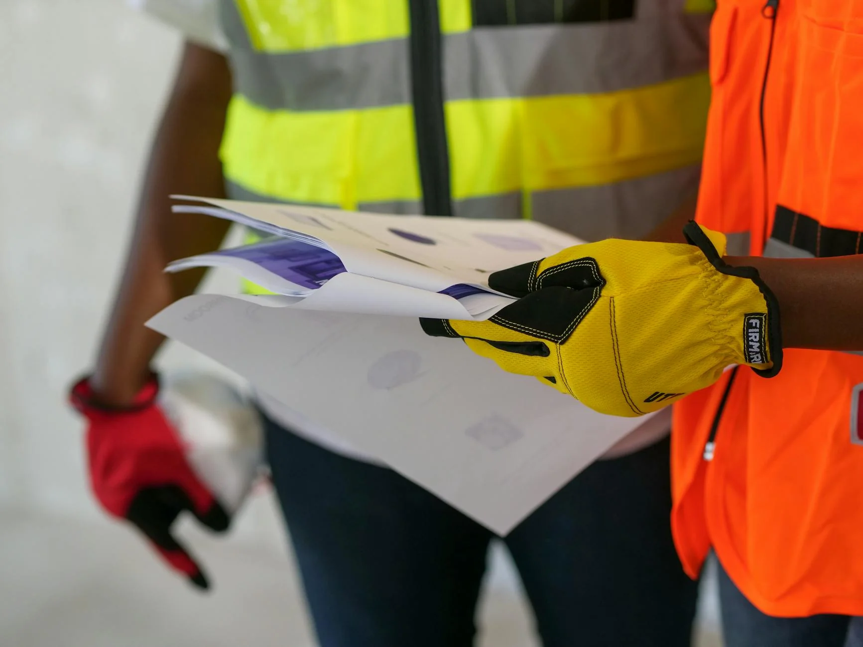 A subcontractor on a job site reviewing a lien waiver PDF on a tablet