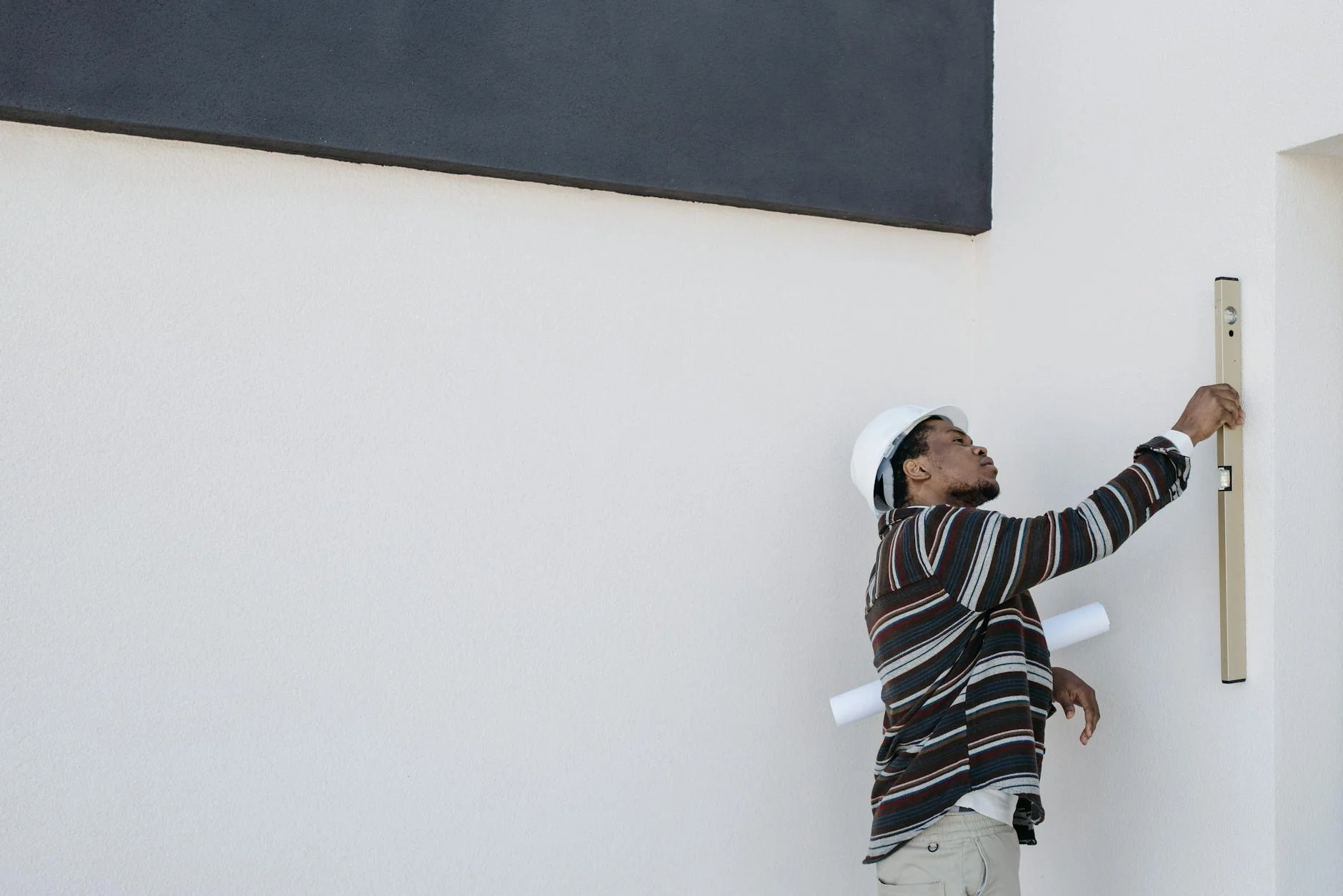 Subcontractor checking a bank balance on a phone before signing an unconditional progress payment lien waiver
