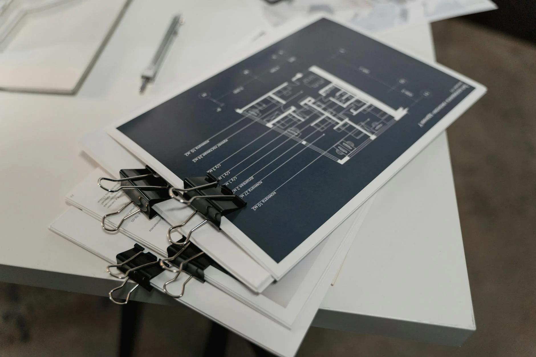 Two construction documents laid side by side on a desk, the visual analogue of comparing a lien release with a lien waiver